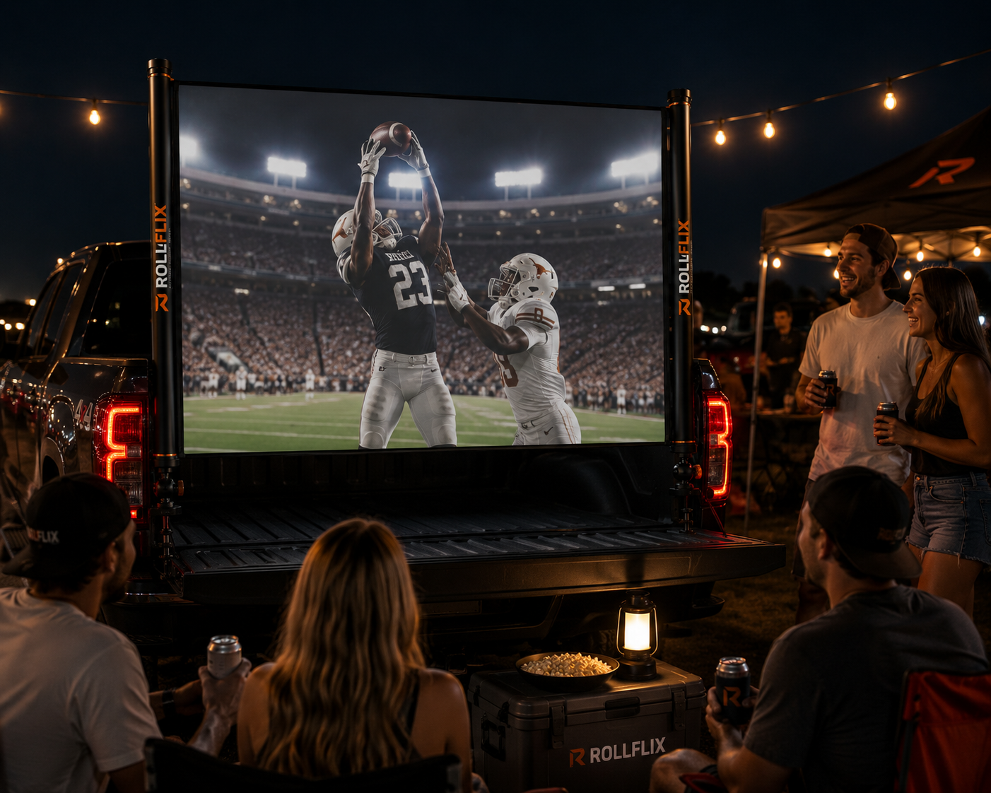Rollflix mounted on a pickup truck tailgate at night